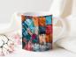 Preview: Weißer Keramikbecher mit einem farbenfrohen Patchwork-Design, das ein Herzmotiv zeigt. Der Becher ist mit Stoffmustern in Blau-, Rot-, und Orangetönen bedruckt, und der Text 'love to craft' ist in einer weißen, geschwungenen Schrift am unteren Rand sichtb